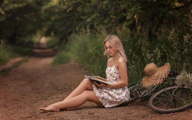 Woman reading bicycle flower basket free wallpaper - medium preview image