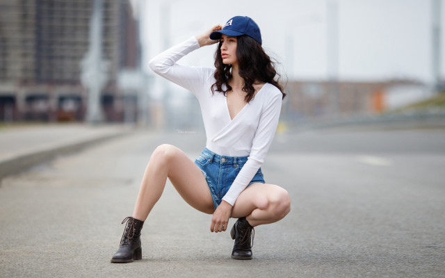 Woman kneeling road hat boots free wallpaper - medium preview image