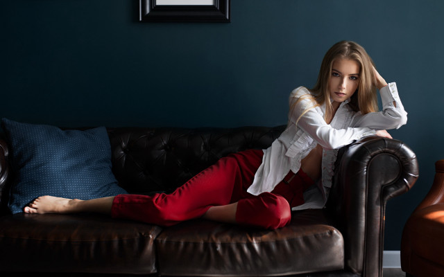 Woman sitting couch blue wall #2 free wallpaper - medium preview image