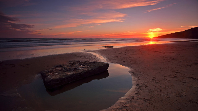 Rock beach sunset ocean sky free wallpaper - medium preview image