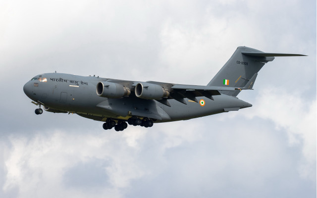 Military plane cloudy sky landing free wallpaper - medium preview image