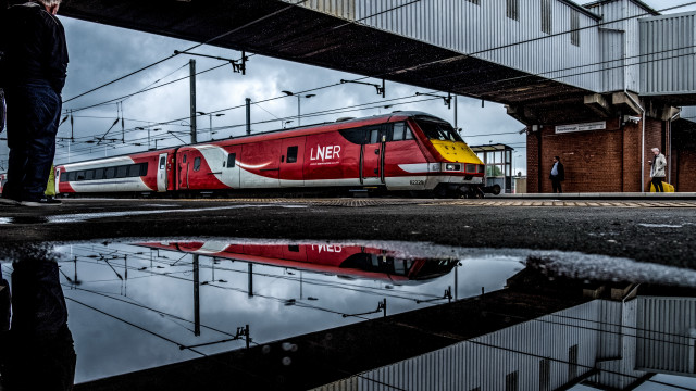 Red train bridge platform puddle free wallpaper - medium preview image