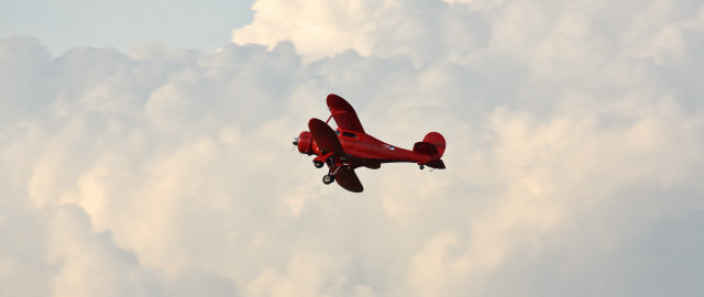 Red plane blue sky clouds free wallpaper - medium preview image