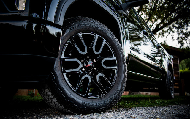 Black truck tire trees building free wallpaper - medium preview image