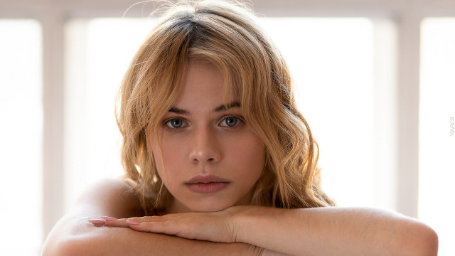Woman crossed arms serious portrait free wallpaper - medium preview image