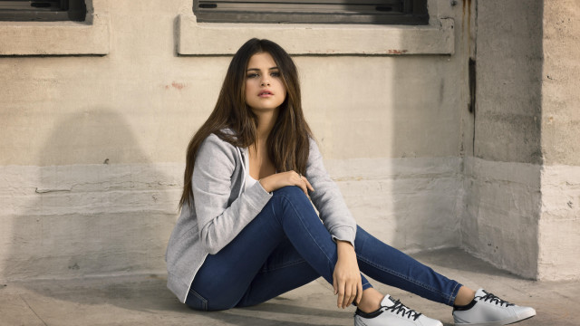 Woman sitting blue pants long free wallpaper - medium preview image
