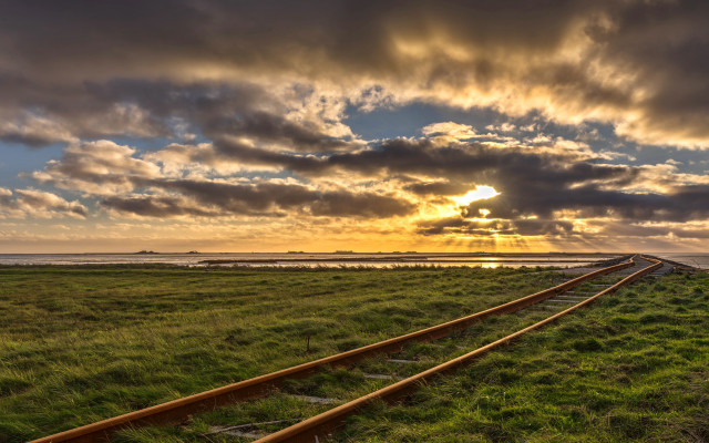 Train track grassy field sunset free wallpaper - medium preview image