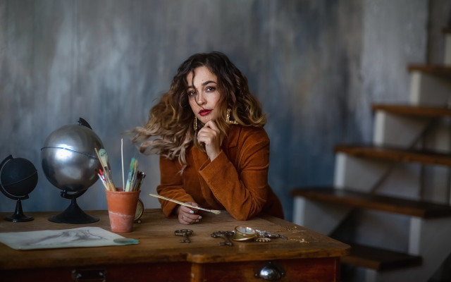Woman sitting desk pen globe free wallpaper - medium preview image