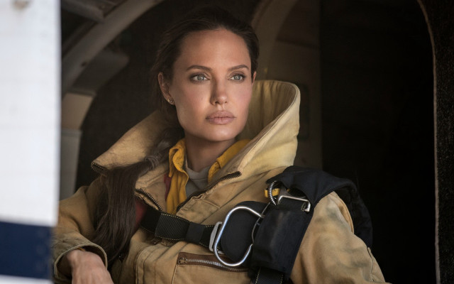 Woman yellow jacket window camera free wallpaper - medium preview image