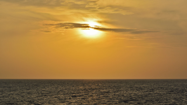 Boat sunset ocean clouds orange free wallpaper - medium preview image