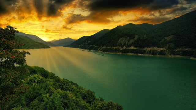 Lake mountains sunset clouds boat free wallpaper - medium preview image