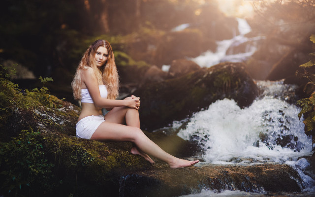 Woman sitting by waterfall forest free wallpaper - medium preview image