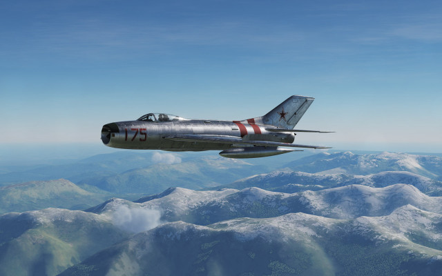 Fighterjet mountainrange sky ocean beach free wallpaper - medium preview image