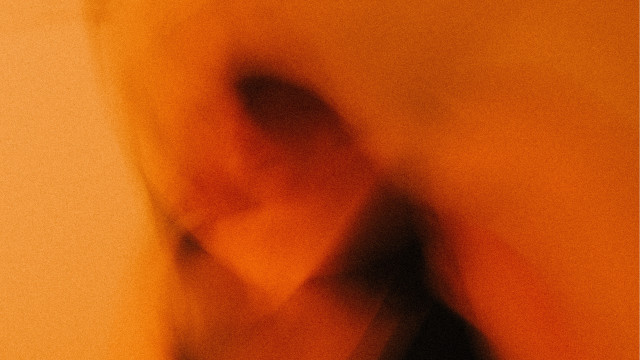 Blurry person black shirt yellow free wallpaper - medium preview image