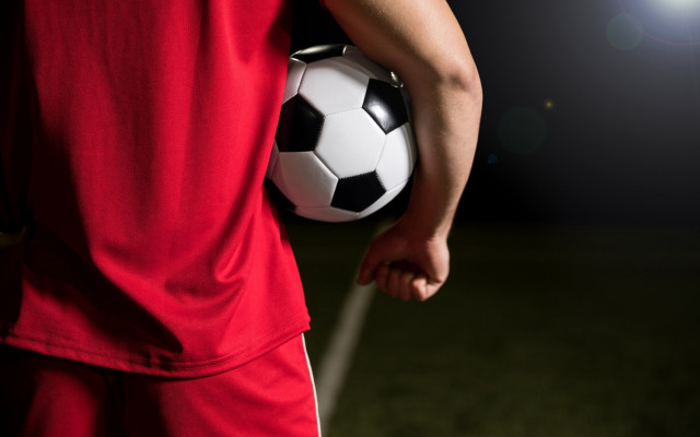 Soccer player spotlight night field free wallpaper - medium preview image