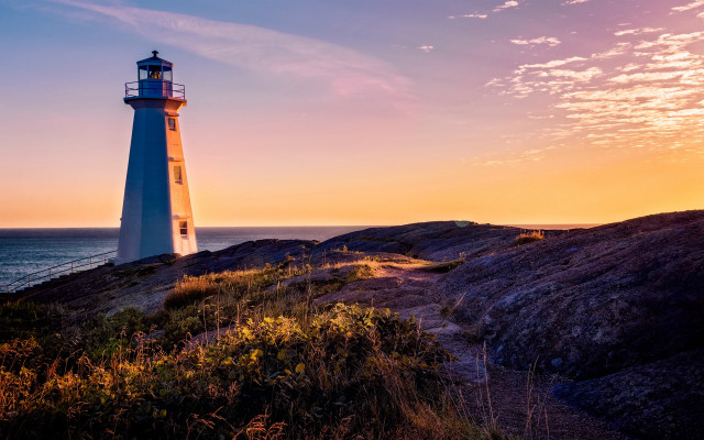 Lighthouse rockycliff ocean sunset pinksky free wallpaper - medium preview image