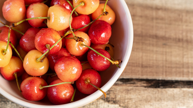 Bowl cherries wooden table spoon free wallpaper - medium preview image