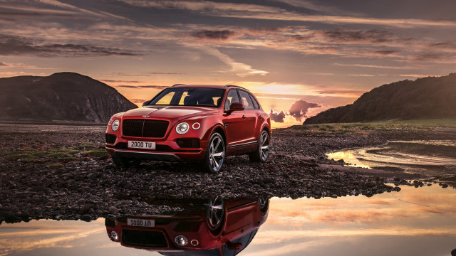 Red suv rocky shore sunset free wallpaper - medium preview image