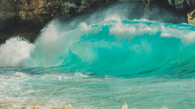 Wave shore cliff beach person free wallpaper - medium preview image