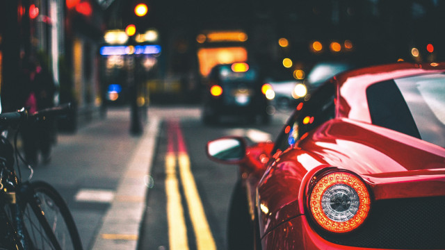 Red sports car street bokeh free wallpaper - medium preview image
