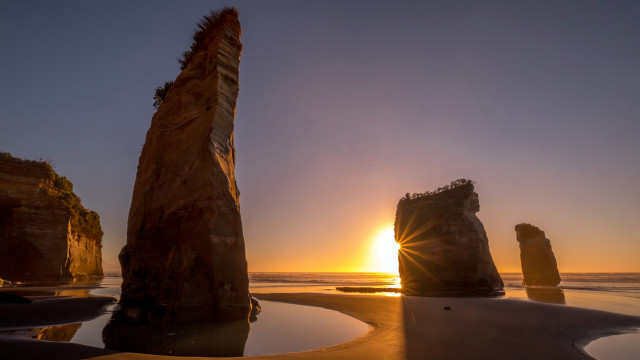 Sunset ocean rocks beach reflection free wallpaper - medium preview image