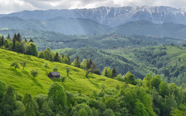 Green hillside cabin mountains clouds free wallpaper - medium preview image