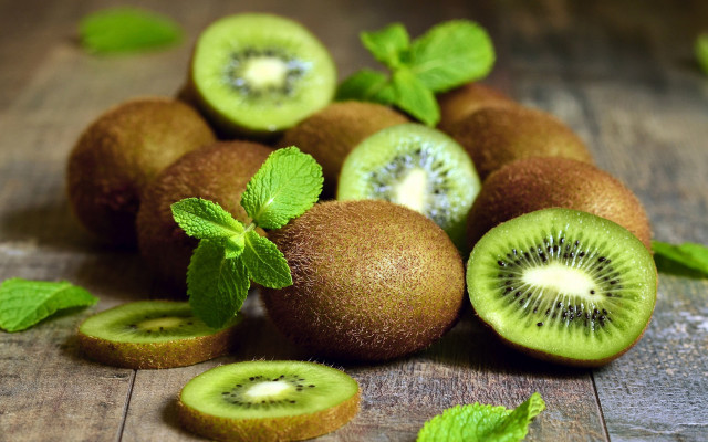 Kiwis leaves wooden table spoon free wallpaper - medium preview image