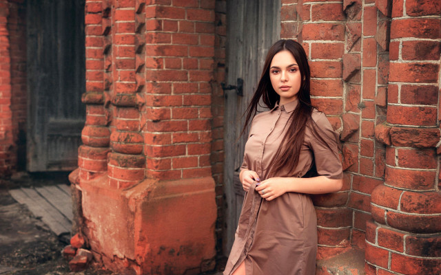 Woman brick building honeycomb fence free wallpaper - medium preview image