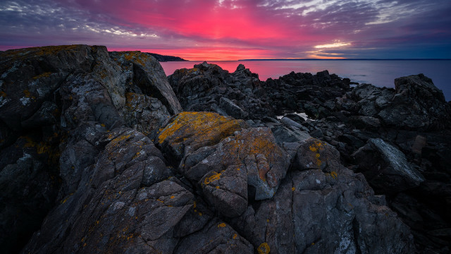 Rocky shore mountain sunset ocean free wallpaper - medium preview image