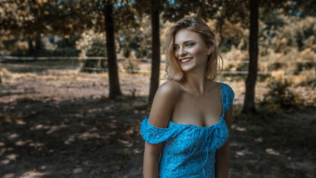 Woman blue dress wooded outdoors free wallpaper - medium preview image