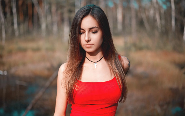 Woman red top forest blurry free wallpaper - medium preview image