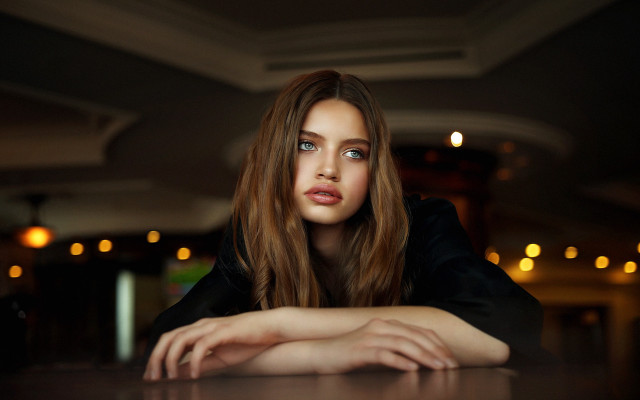 Serious blonde woman table long free wallpaper - medium preview image