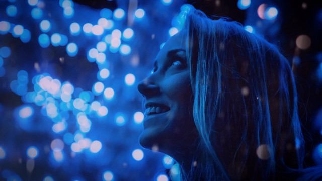 Woman smiling fireworks blue lights free wallpaper - medium preview image
