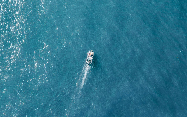 Boat ocean minimalism tiltshift astronaut free wallpaper - medium preview image