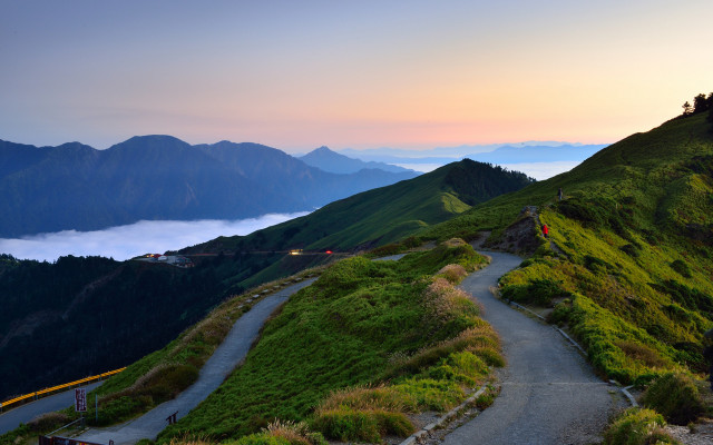 Mountain road clouds hill person free wallpaper - medium preview image