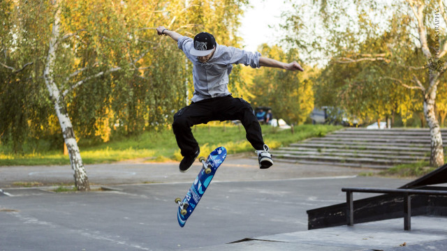 Man flying skateboard park trees free wallpaper - medium preview image