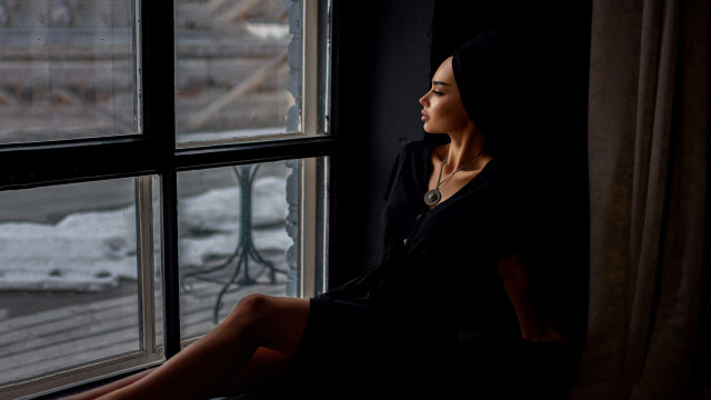 Woman sitting window sill snowy free wallpaper - medium preview image