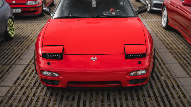 Red car parking lot truck free wallpaper - medium preview image