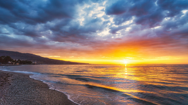 Sunset ocean beach mountains cloudy free wallpaper - medium preview image