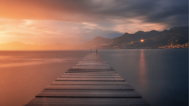 Long dock sunset mountains lighthouse free wallpaper - medium preview image
