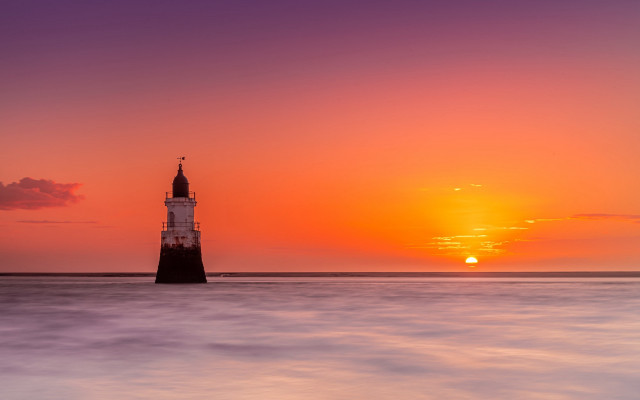 Lighthouse island ocean sunset boat free wallpaper - medium preview image