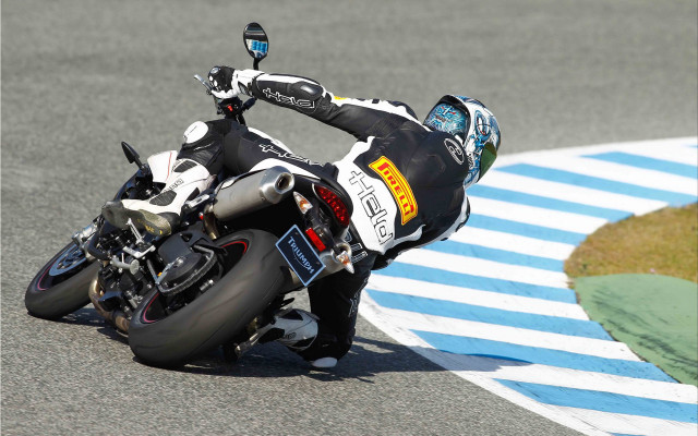 Man riding motorcycle race track free wallpaper - medium preview image