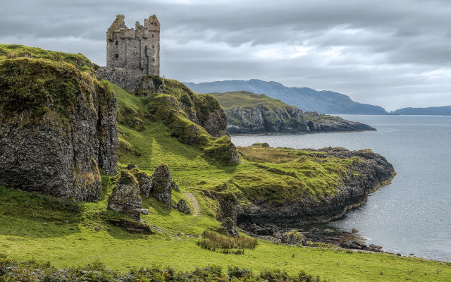 Castle cliff overlooking water mountains free wallpaper - medium preview image