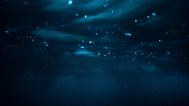 Dark blue ocean bubbles surfer free wallpaper - medium preview image