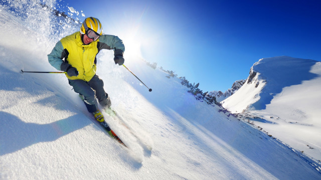 Man skiing snowy slope sunny #2 free wallpaper - medium preview image