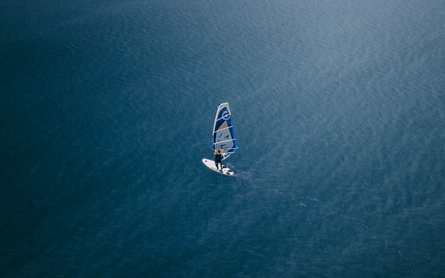 Sailboat rider ocean sunny day free wallpaper - medium preview image