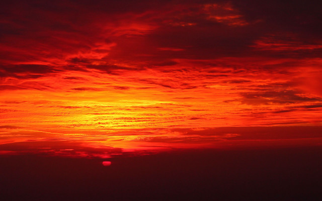 Red sky plane sunset ocean free wallpaper - medium preview image