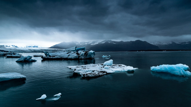 Icebergs water mountains sky bird free wallpaper - medium preview image