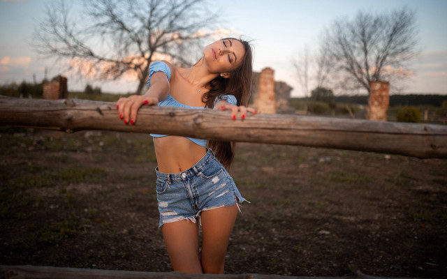 Woman leaning fence smiling autumn free wallpaper - medium preview image