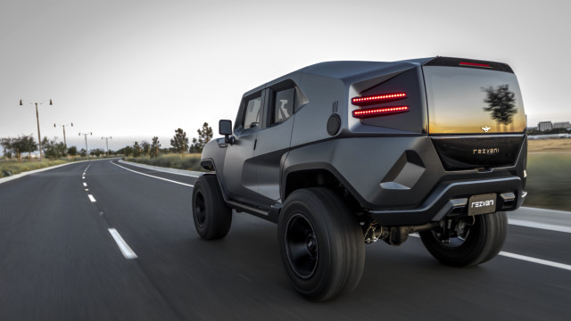 Black suv driving road grass free wallpaper - medium preview image